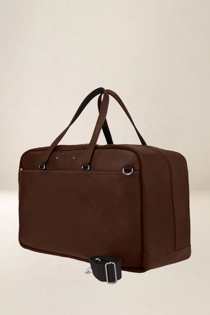 Sac de voyage en cuir pleine fleur ZEUS coloris cognac, vue de profil n°1 – Ateliers Fourès