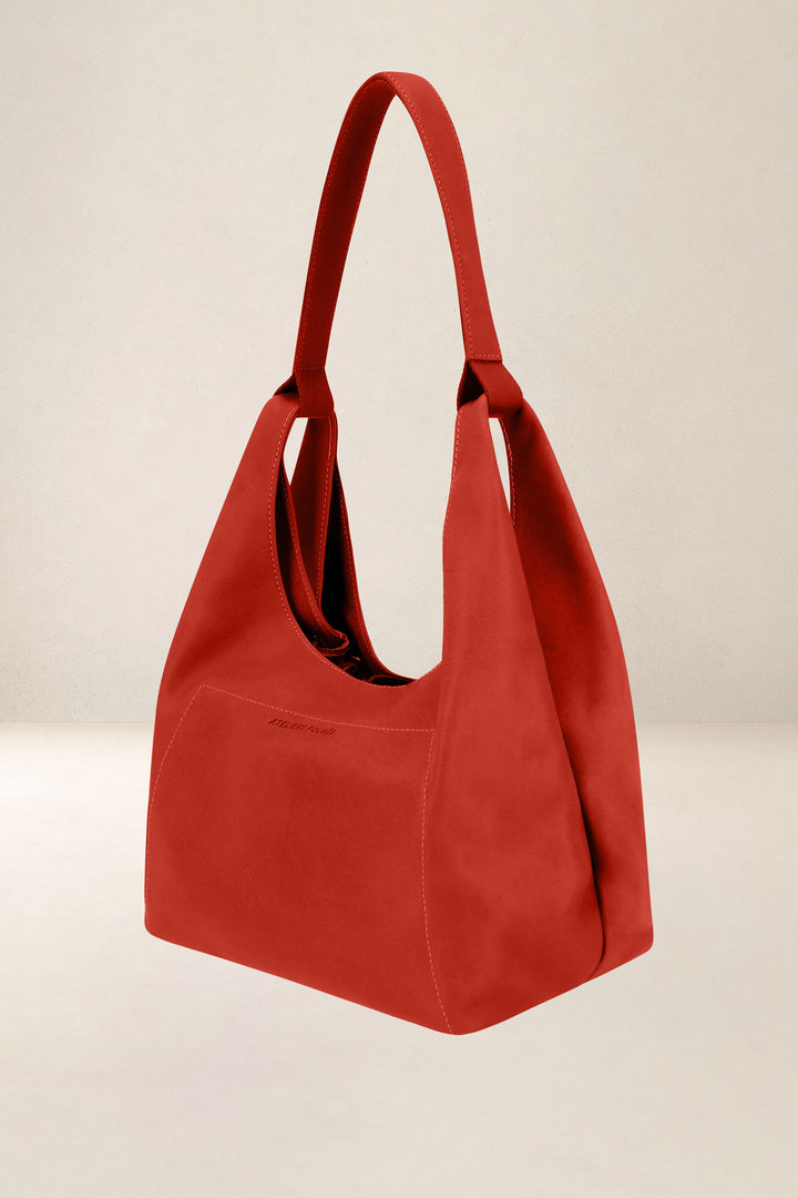 Sac à main en cuir pleine fleur AMAZONE coloris orange confit, vue de profil n°1 – Ateliers Fourès