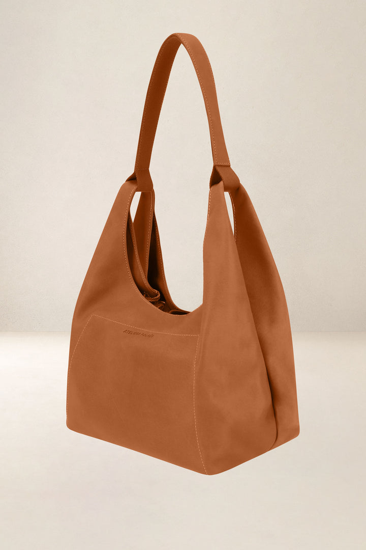 Sac à main en cuir pleine fleur AMAZONE coloris lionne, vue de profil n°1 – Ateliers Fourès