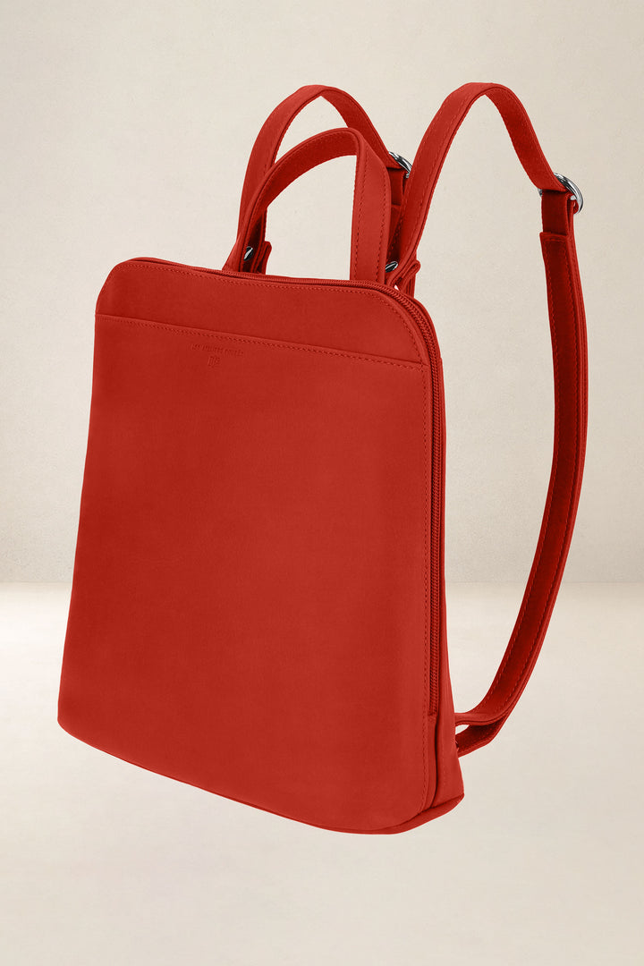Sac à dos en cuir pleine fleur ANDROMÈDE coloris orange confit, vue de profil n°1 – Ateliers Fourès