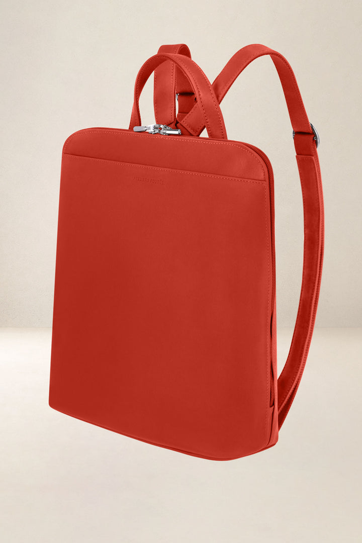 Sac à dos en cuir pleine fleur ANDROMÈDE coloris orange confit, vue de profil n°1 – Ateliers Fourès